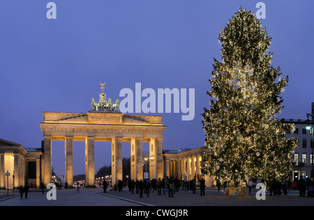 Brandenburg Gate, Pariser Platz, during the Advent season with snow and Christmas tree, Berlin, Germany, Europe Stock Photo