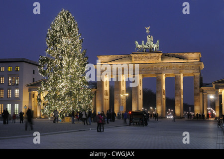 Brandenburg Gate, Pariser Platz, during the Advent season with snow and Christmas tree, Berlin, Germany, Europe Stock Photo