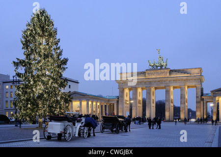 Brandenburg Gate, Pariser Platz, during the Advent season with snow and Christmas tree, Berlin, Germany, Europe Stock Photo