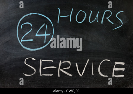 24 Hours service words written on the chalkboard Stock Photo