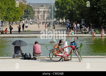 Paris, France. Jardin des Tuileries. People relaxing on very hot day Stock Photo