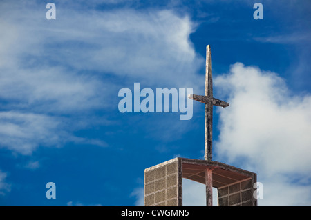 Old church's cross against blue sky Stock Photo