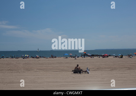 People enjoy the summer sun at Coney Island Stock Photo