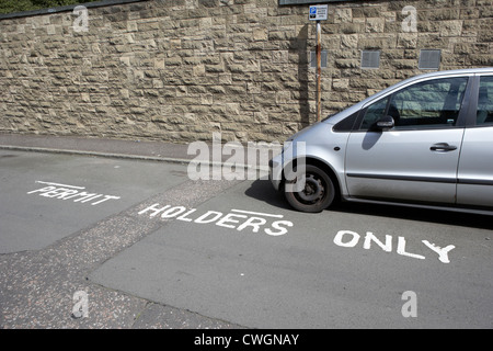 resident permit holders only parking bays on a residential street in edinburgh, scotland, uk, united kingdom Stock Photo