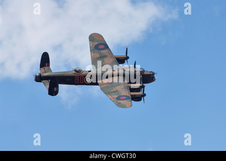 Avro Lancaster bomber of the Battle of Britain Memorial Flight, over-flying Little Gransden airfield. Stock Photo