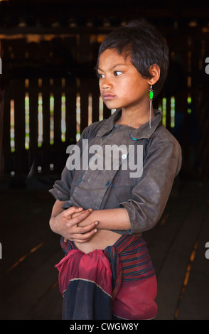 A ANN TRIBAL girl in traditional dress in her village near KENGTUNG also known as KYAINGTONG - MYANMAR Stock Photo