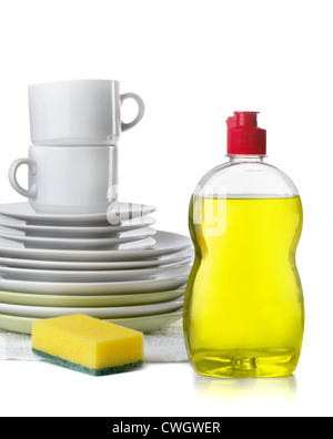 Bottle of dishwashing liquid and stack of utensils isolated on white Stock Photo