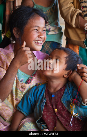 ANN TRIBAL CHILDREN laughing in a village near KENGTUNG or KYAINGTONG - MYANMAR Stock Photo