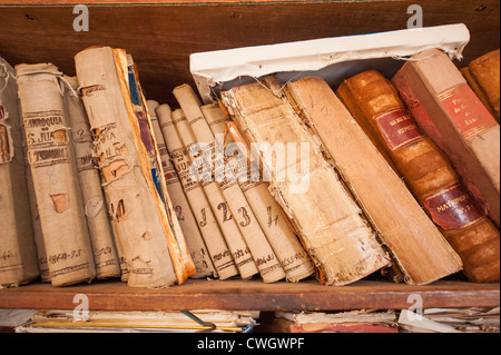 Old religious books on shelf inside Iglesia Mayor of San Juan Bautista church in Remedios, Cuba. Stock Photo