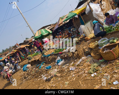 Horizontal wide angle view of a typical fruit and vegetable market along a street in Cambodia Stock Photo