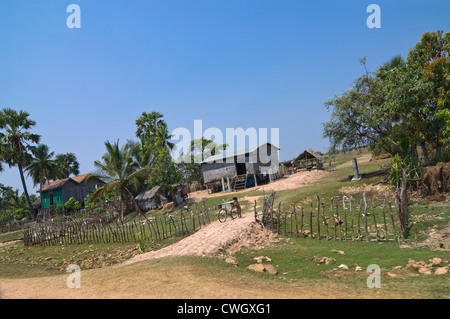 Horizontal wide angle view of a typical wooden house on stilts in rural Cambodia Stock Photo