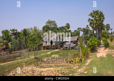 Horizontal wide angle view of a typical wooden house on stilts in rural Cambodia Stock Photo