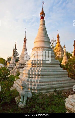 A field of STUPAS are part of the MAHAMUNI PAYA or TEMPLE complex built by King Bodawpaya in 1784 - MANDALAY, MYANMAR Stock Photo