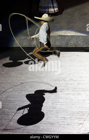 Sones de Floreo (Tricks with Rope) performed at  Xcaret , Mexico Espectacular, scene representing state of Jalisco. Stock Photo