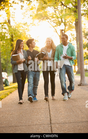 Students walking together on campus Stock Photo