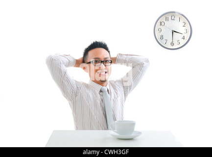 asian man having tea break, relaxed posture Stock Photo