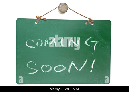 Coming soon words on green board isolated on white background Stock Photo