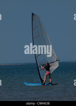 Young woman learning to windsurf, Instow, Devon, UK Stock Photo