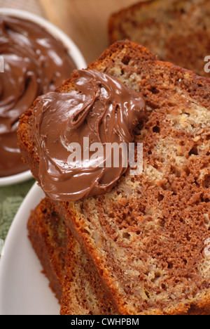 Freshly baked banana and chocolate nut bread with Nutells Stock Photo