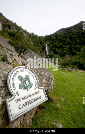 A National Trust Boundary sign for the Carneddau area of Snowdonia, this one is near Aber Falls (in the background) Stock Photo