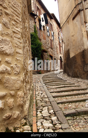 A narrow street between buildings with steep stairs Stock Photo