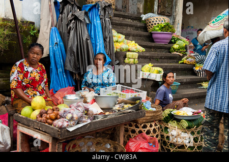 The Ubud, Bali Public Market is a very busy and colorful place with shoppers and sellers arriving very early in the morning. Stock Photo