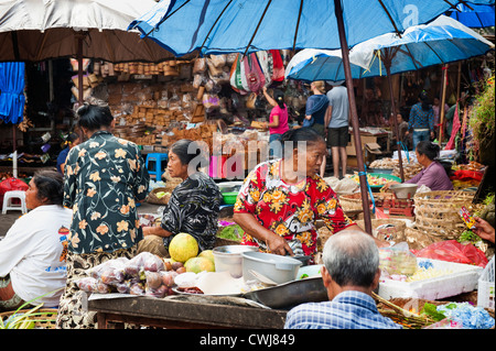 The Ubud, Bali Public Market is a very busy and colorful place with shoppers and sellers arriving very early in the morning. Stock Photo