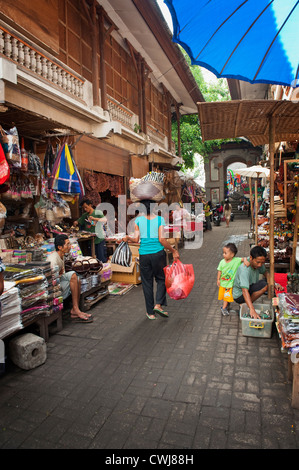 The Ubud, Bali Public Market is a very busy and colorful place with shoppers and sellers arriving very early in the morning. Stock Photo