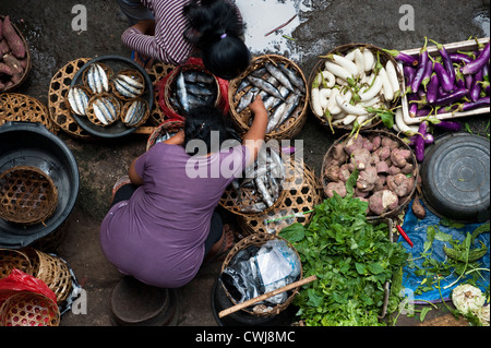 The Ubud, Bali Public Market is a very busy and colorful place with shoppers and sellers arriving very early in the morning. Stock Photo