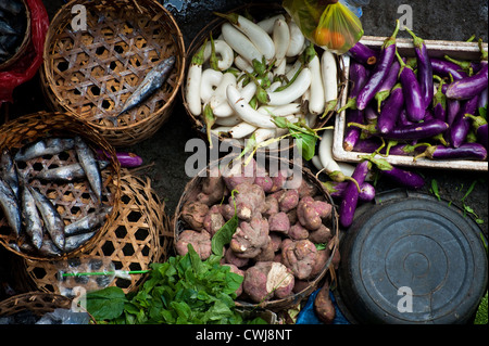 The Ubud, Bali Public Market is a very busy and colorful place with shoppers and sellers arriving very early in the morning. Stock Photo