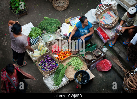 The Ubud, Bali Public Market is a very busy and colorful place with shoppers and sellers arriving very early in the morning. Stock Photo