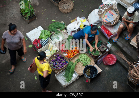 The Ubud, Bali Public Market is a very busy and colorful place with shoppers and sellers arriving very early in the morning. Stock Photo