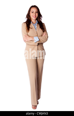 Beautiful attractive happy smiling corporate business woman standing with arms crossed in beige suit, isolated. Stock Photo