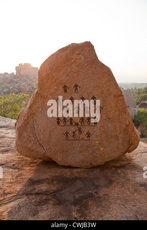 Ancient art on boulder in Hampi Stock Photo