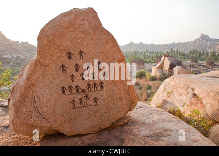 Ancient art on a boulder in Hampi Stock Photo