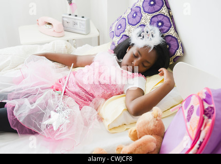 Black girl sleeping in fairy costume Stock Photo