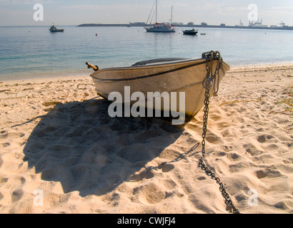 Aluminium dinghy on beach sand Stock Photo