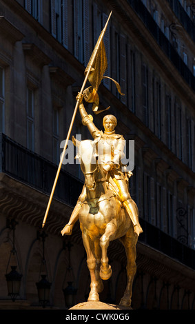 Joan of Arc statue, Gold equestrian statue of Joan of Arc holding a flag mounted on horseback Place des Pyramides Rue de Rivoli Paris France EU Europe Stock Photo