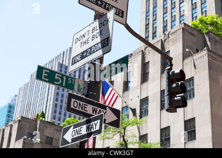 Manhattan, New York City, NYC road signs for 5th avenue & East 51st Street with one way & don't block the box sign Stock Photo