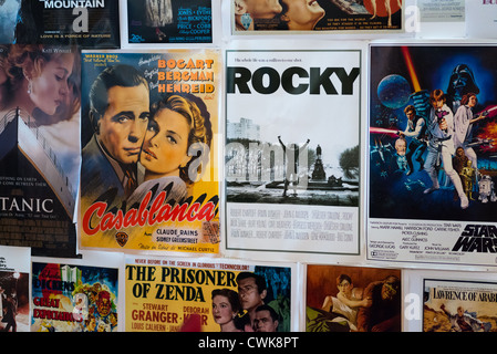 Iconic Hollywood movie posters on wall.