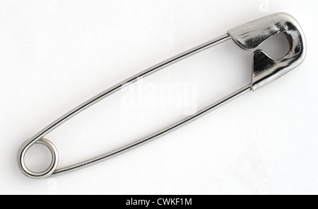 Close up shot of a safety pin on white background Stock Photo