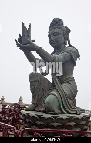 Asia, China, Hong Kong. Tian Tan Statues, attendants to the great Buddha, Po Lin Monastery, Lantau Island. Stock Photo