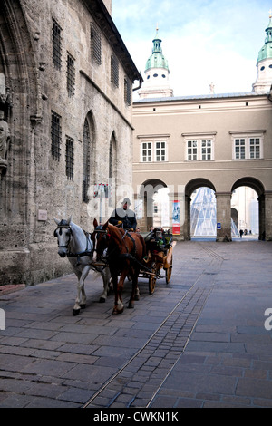 Salzburg, Austria: Horse-drawn carriage rides are a time-honored way to tour this city's compact heart. Stock Photo