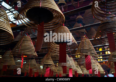 Incense coils burning in Man Mo Temple Hong Kong, China. 25-Aug-2012 Stock Photo