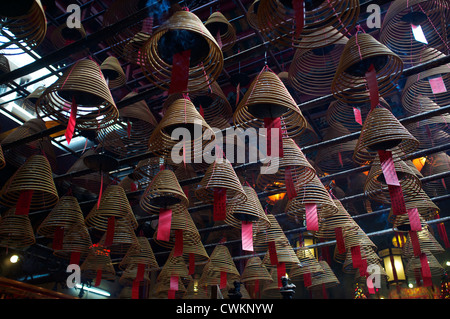 Incense coils burning in Man Mo Temple Hong Kong, China. 25-Aug-2012 Stock Photo
