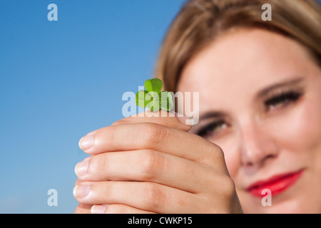 woman with four leafed clover Stock Photo