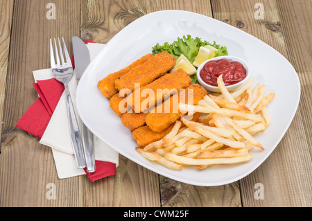 Portion of Fish Fingers and Chips on wooden background Stock Photo