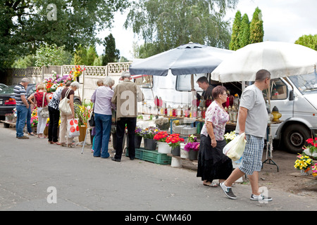 Purchasing flowers outside the gates. Roman Catholic Church's Cemetery Cmentarz Rzymskokatolicki Lodz Central Poland Stock Photo