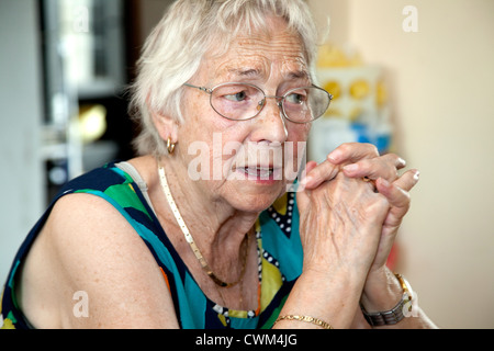Attractive great grandmother age 86 in a kitchen conversation. Zawady Central Poland Stock Photo
