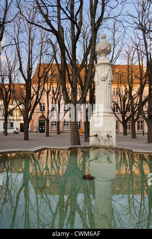 Fountain reflection in Muensterplatz (Munster square) in Basel, Switzerland. Stock Photo